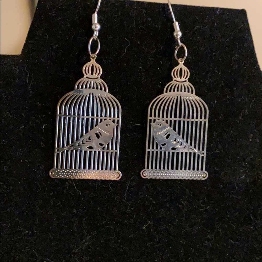 Metal laser cut bird in a cage